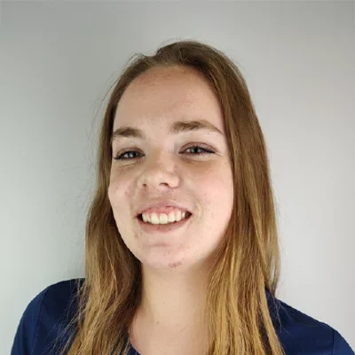A headshot photo of Sarah, a massage therapist